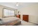 Bright bedroom with double bed, dresser, and window at 460 Paula S Dr # 401, Dunedin, FL 34698