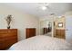 Bright bedroom with double dresser and mirrored closet doors at 460 Paula S Dr # 401, Dunedin, FL 34698