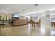 Spacious community room with seating, TV, and exercise equipment at 460 Paula S Dr # 401, Dunedin, FL 34698