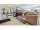 Community room features comfortable seating, a TV, and exercise equipment at 460 Paula S Dr # 401, Dunedin, FL 34698