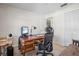 Home office features a large desk, comfortable chair, and built-in shelving at 460 Paula S Dr # 401, Dunedin, FL 34698
