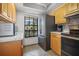 Bright kitchen features modern appliances and ample cabinetry at 460 Paula S Dr # 401, Dunedin, FL 34698