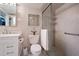 Clean bathroom with a walk-in shower and white vanity at 4900 Brittany S Dr # 909, St Petersburg, FL 33715