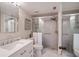 Updated bathroom with a shower and white vanity at 4900 Brittany S Dr # 909, St Petersburg, FL 33715