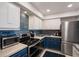 Modern kitchen with stainless steel appliances and blue cabinets at 4900 Brittany S Dr # 909, St Petersburg, FL 33715