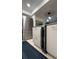Modern kitchen features stainless steel appliances and wine cooler at 4900 Brittany S Dr # 909, St Petersburg, FL 33715