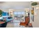 Living room with water views and mid-century modern furniture at 4900 Brittany S Dr # 909, St Petersburg, FL 33715