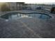 Community pool with brick patio at 4900 Brittany S Dr # 909, St Petersburg, FL 33715