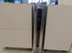 Stainless steel wine cooler built into kitchen cabinetry at 4900 Brittany S Dr # 909, St Petersburg, FL 33715