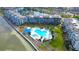 Aerial view of the waterfront condos and community pool, surrounded by lush landscaping at 5155 S Isla Key S Blvd # 202, St Petersburg, FL 33715