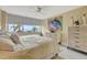 Primary bedroom with water view and large bed at 5155 S Isla Key S Blvd # 202, St Petersburg, FL 33715