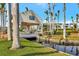 Community entrance with a bridge and water feature at 5155 S Isla Key S Blvd # 202, St Petersburg, FL 33715