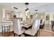 Bright dining area with seating for four and a view into the living room at 5155 S Isla Key S Blvd # 202, St Petersburg, FL 33715