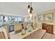 Elegant dining area with a wooden table, ocean view, and seating for four at 5155 S Isla Key S Blvd # 202, St Petersburg, FL 33715