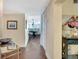 Hallway featuring wood-look flooring, updated decor, leading to the dining and living areas at 5155 S Isla Key S Blvd # 202, St Petersburg, FL 33715