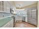 Modern kitchen with stainless steel appliances and light blue countertops at 5155 S Isla Key S Blvd # 202, St Petersburg, FL 33715