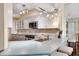 Modern kitchen with white cabinets, stainless steel appliances, and a light blue countertop at 5155 S Isla Key S Blvd # 202, St Petersburg, FL 33715