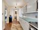 Bright kitchen features white cabinets, stainless steel appliances, and a unique aqua-colored countertop at 5155 S Isla Key S Blvd # 202, St Petersburg, FL 33715