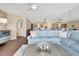 Spacious living room with a comfortable sofa, modern decor, and view to dining area at 5155 S Isla Key S Blvd # 202, St Petersburg, FL 33715