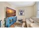Living room with large TV, comfy couch, and coffee table at 5155 S Isla Key S Blvd # 202, St Petersburg, FL 33715