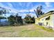 Backyard of the property with green grass at 6021 Ridgewood Dr, Zephyrhills, FL 33542