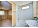 Bathroom includes a tub, sink, and access to bedroom at 6021 Ridgewood Dr, Zephyrhills, FL 33542