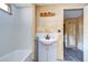 Clean bathroom with a white vanity and bathtub at 6021 Ridgewood Dr, Zephyrhills, FL 33542