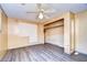 Spacious bedroom with built-in closet and vinyl flooring at 6021 Ridgewood Dr, Zephyrhills, FL 33542