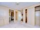 Spacious bedroom with mirrored doors and neutral carpet at 6021 Ridgewood Dr, Zephyrhills, FL 33542