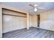 Bedroom with built-in closet and bathroom access at 6021 Ridgewood Dr, Zephyrhills, FL 33542