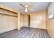 Bright bedroom featuring vinyl flooring and access to bathroom at 6021 Ridgewood Dr, Zephyrhills, FL 33542