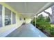 Covered patio with access to the home and backyard at 6021 Ridgewood Dr, Zephyrhills, FL 33542