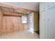 Home entryway with wood paneling and coat rack at 6021 Ridgewood Dr, Zephyrhills, FL 33542