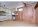 Small kitchen with white cabinets and appliances at 6021 Ridgewood Dr, Zephyrhills, FL 33542