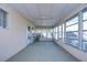 Sunroom with multiple windows and carpet flooring at 6021 Ridgewood Dr, Zephyrhills, FL 33542