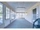Sunroom with ample windows and carpet flooring at 6021 Ridgewood Dr, Zephyrhills, FL 33542