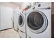 Laundry room with washer, dryer, and utility sink at 714 Sugar Camp Way, Brooksville, FL 34604