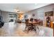 Spacious living room includes an adjacent dining area and a sliding door entrance at 714 Sugar Camp Way, Brooksville, FL 34604