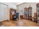 Office space with hardwood floors, desk, chair and decorative display cases at 714 Sugar Camp Way, Brooksville, FL 34604
