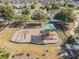 Community playground with slides and swings provides outdoor recreation in a secure, fenced setting at 714 Sugar Camp Way, Brooksville, FL 34604