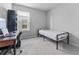 Small bedroom with a twin bed and workspace at 10773 Hawks Landing Dr, Land O Lakes, FL 34638