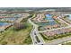 Aerial view of a community with houses, lakes, and lush landscaping at 11111 Callisia Dr, Odessa, FL 33556