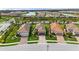 Aerial view of homes with tile roofs and lush landscaping at 11111 Callisia Dr, Odessa, FL 33556