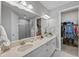 Double vanity bathroom with a walk-in shower and large closet at 11111 Callisia Dr, Odessa, FL 33556