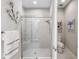 Walk-in shower with glass enclosure and adjacent toilet at 11111 Callisia Dr, Odessa, FL 33556