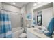 Clean bathroom with a shower/tub combo and white vanity at 11111 Callisia Dr, Odessa, FL 33556