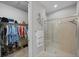 Walk-in shower and closet with plenty of shelving and hanging space at 11111 Callisia Dr, Odessa, FL 33556