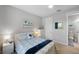 Bright bedroom with a queen bed and access to a full bathroom at 11111 Callisia Dr, Odessa, FL 33556