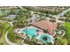 Community pool and clubhouse with tennis courts nearby at 11111 Callisia Dr, Odessa, FL 33556