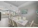 Bright dining room with a large table and seating for six at 11111 Callisia Dr, Odessa, FL 33556